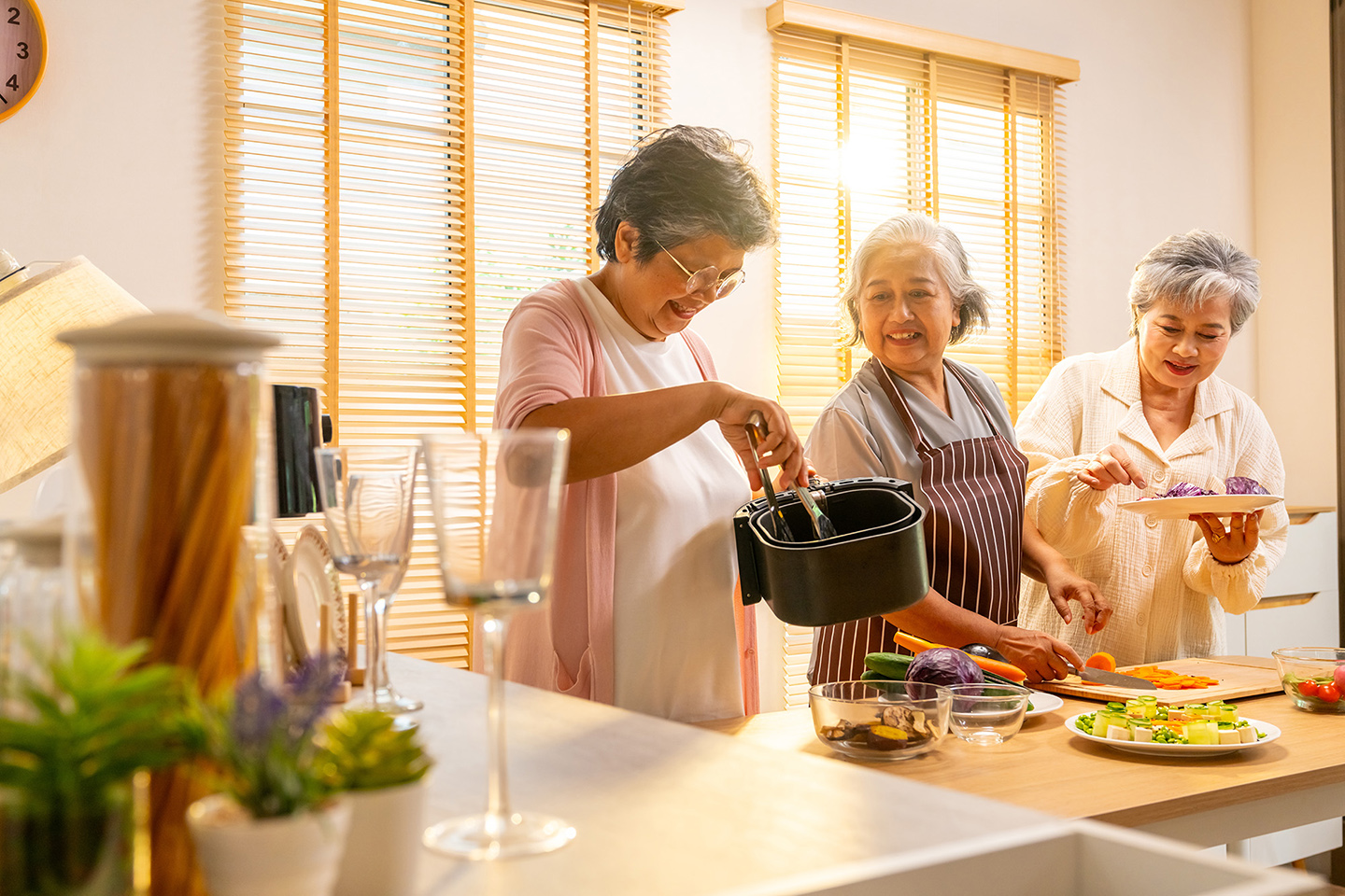 Women cooking together with an air fryer